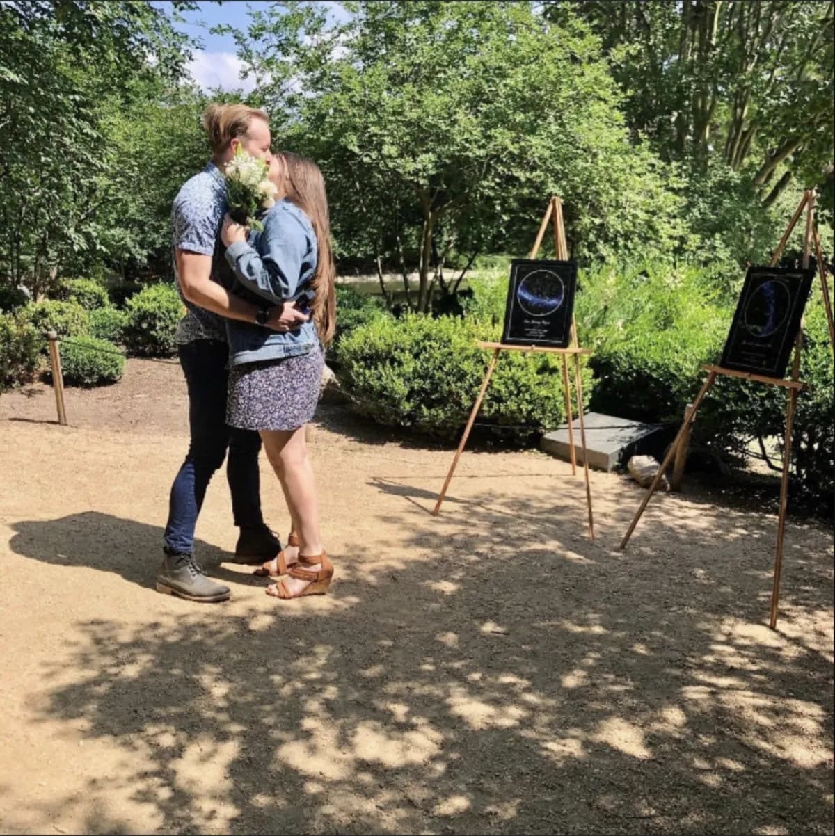 Star map poster hung on a bedroom wall above a nightstand