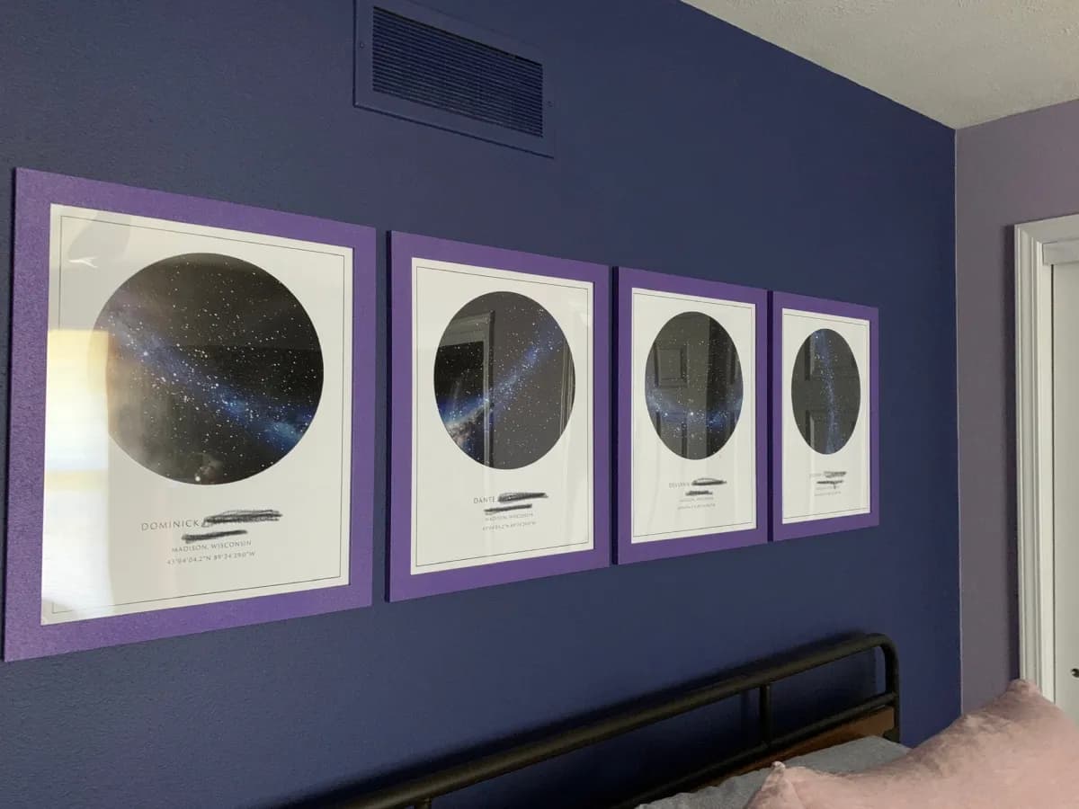 Framed star map above a living room couch