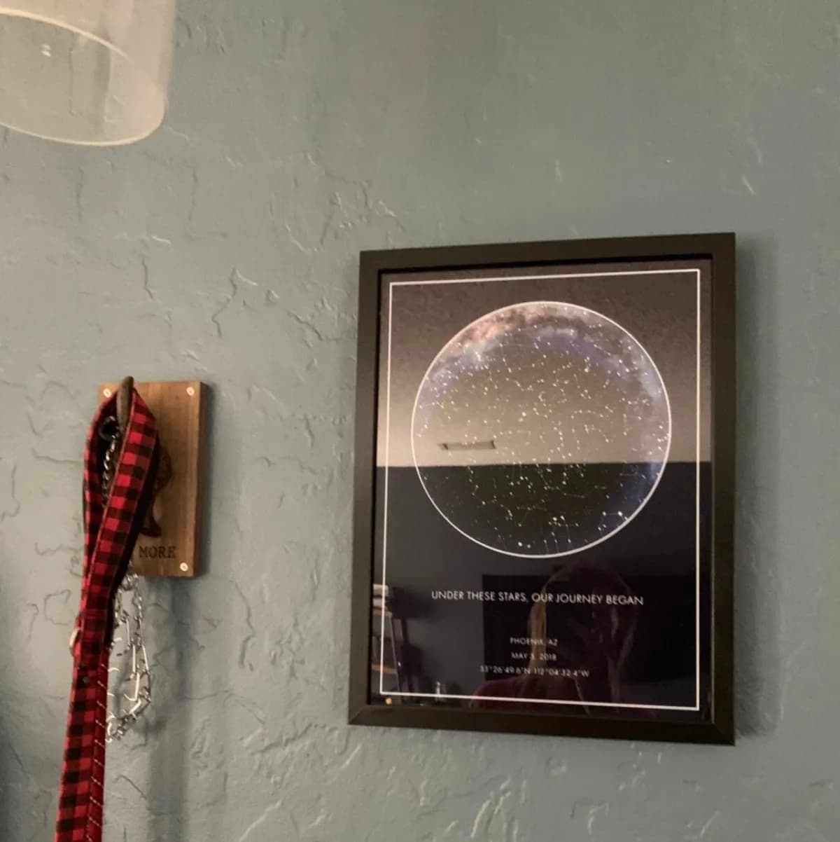 Hands unwrapping a star map poster gift