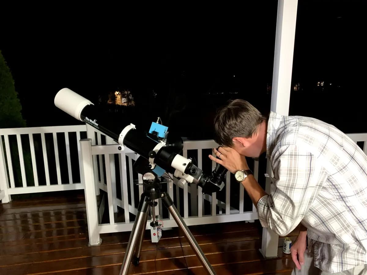 Stargazing through a telescope on a clear night